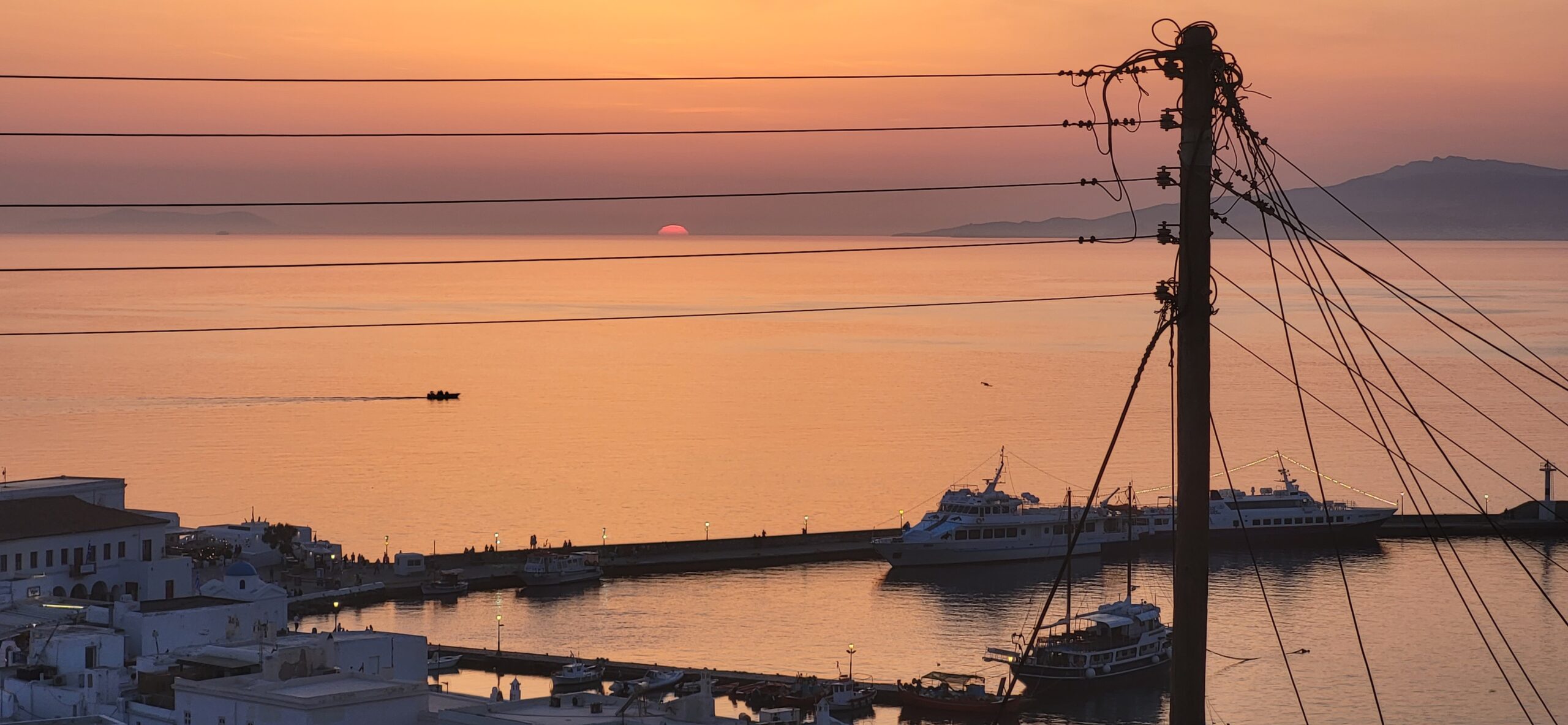 A photo of the sunset over Mykonos town, Greece.