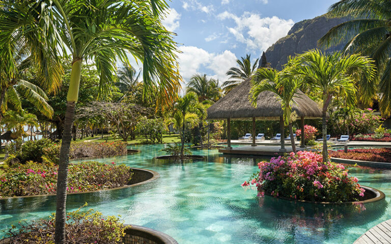 Pool and garden area at Lux* Le Morne Hotel.