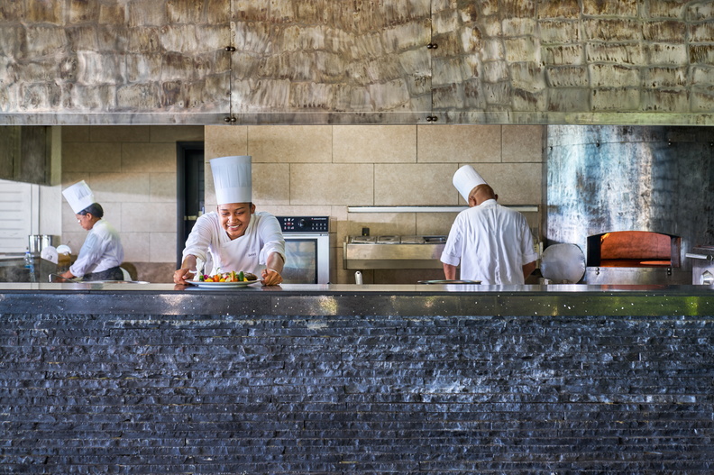 Chefs at Lux* Le Morne's 'The Beach' restaurant prepare food.