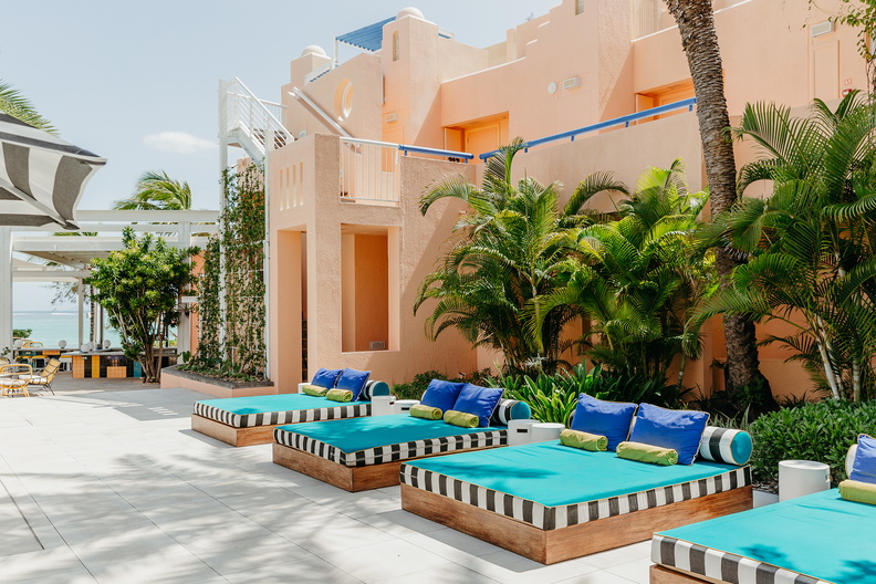 Brightly coloured beach beds in front of SALT of Palmar hotel. 